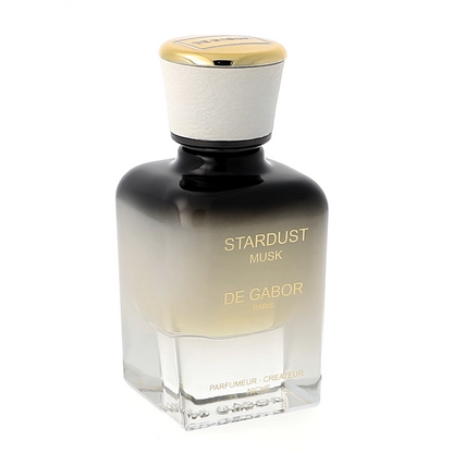 Perfume bottle labeled 'Stardust' by Serge Lutens on a white background